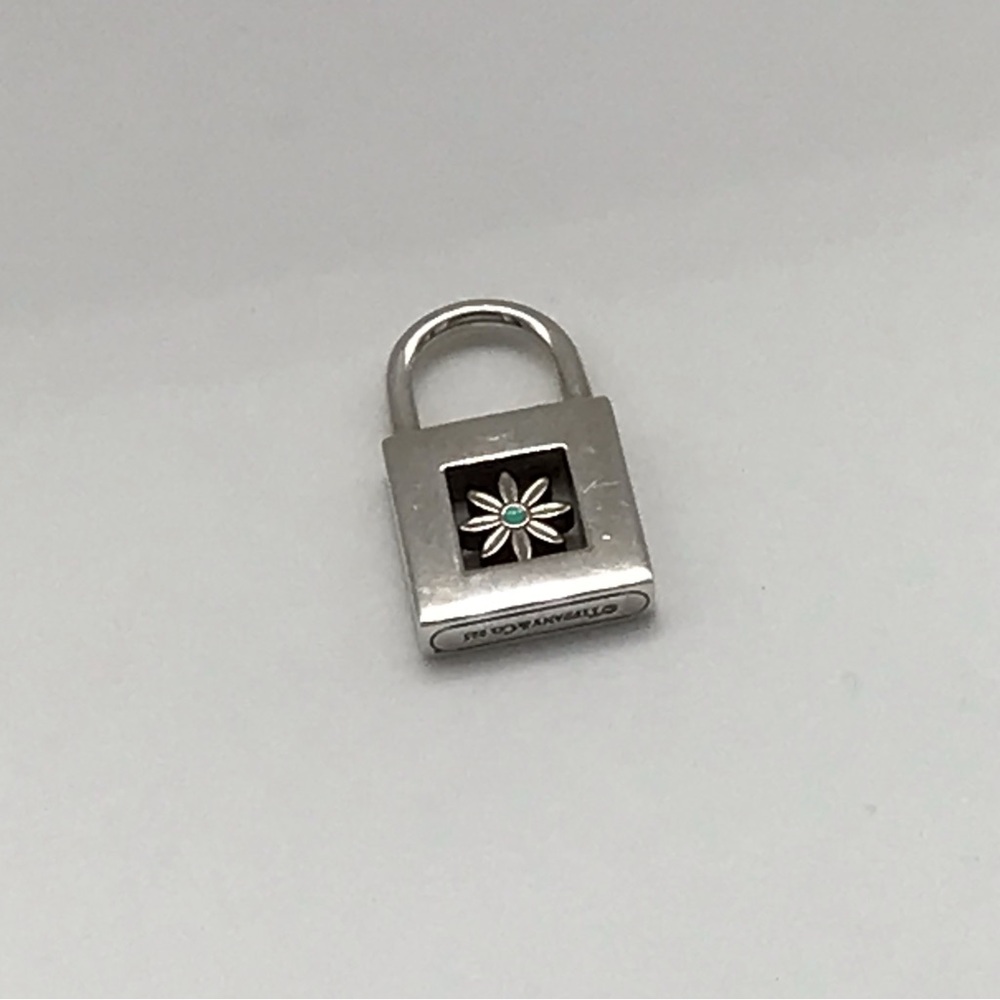 TIFFANY & CO. 925 STERLING DAISY LOCK CHARM WITH ENAMEL   EUC